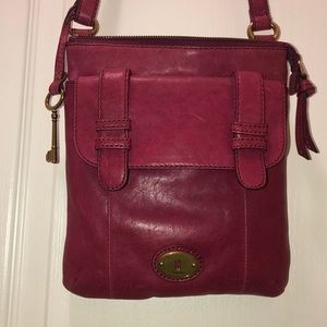 A beautiful cranberry color, fossil purse.